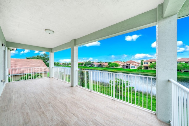 1855 SW Jamesport Dr, Port Saint Lucie, FL 34953 - wooden terrace featuring a water view and a residential view
