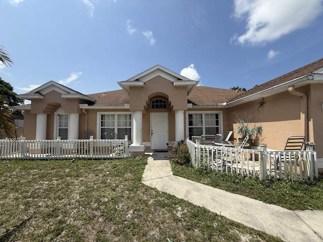 416 SE Calmoso Dr, Port Saint Lucie, FL 34983 - view of front of house featuring stucco siding