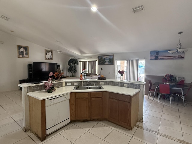 416 SE Calmoso Dr, Port Saint Lucie, FL 34983 - kitchen with dishwasher, a sink, open floor plan, light countertops, and vaulted ceiling