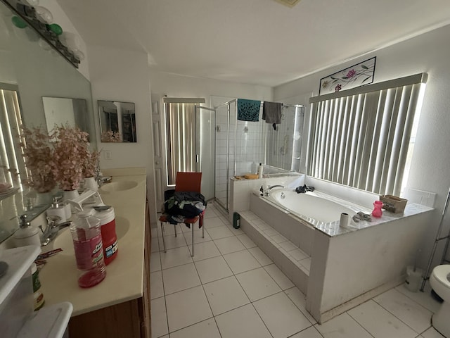 416 SE Calmoso Dr, Port Saint Lucie, FL 34983 - bathroom featuring a bath, a shower stall, tile patterned floors, double vanity, and toilet