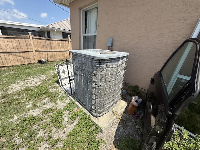 416 SE Calmoso Dr, Port Saint Lucie, FL 34983 - exterior view of stucco siding and central AC unit
