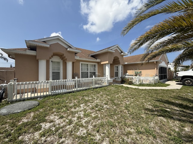 416 SE Calmoso Dr, Port Saint Lucie, FL 34983 - view of front of property with stucco siding