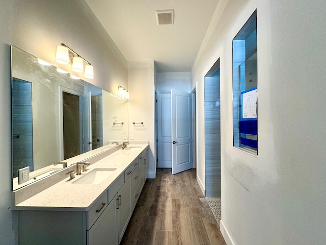 10742 Stellar Cir Unit 11, Palm Beach Gardens, FL 33412 - bathroom with double vanity, wood finished floors, and baseboards