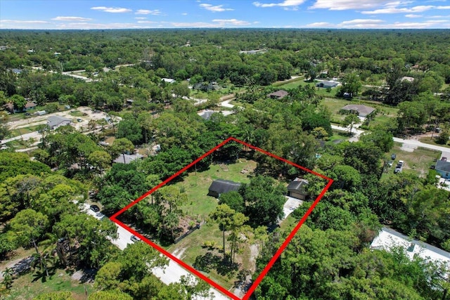 13704 58th Ct N, The Acreage, FL 33411 - aerial overview of property's location featuring a heavily wooded area and property parcel outlined