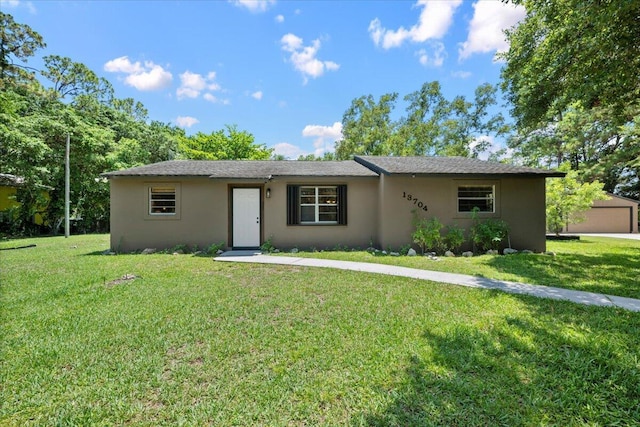 13704 58th Ct N, The Acreage, FL 33411 - ranch-style home with a front lawn and stucco siding