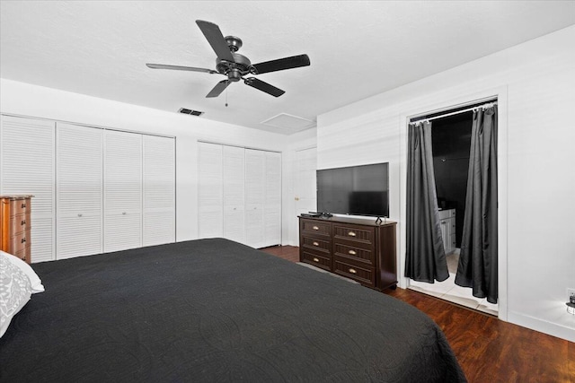 13704 58th Ct N, The Acreage, FL 33411 - bedroom featuring two closets, dark wood-style flooring, a ceiling fan, and baseboards