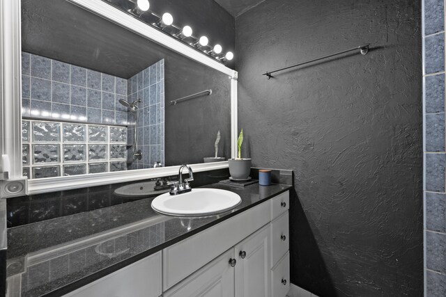 13704 58th Ct N, The Acreage, FL 33411 - full bathroom featuring vanity and a tile shower