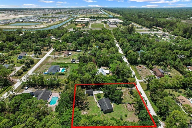13704 58th Ct N, The Acreage, FL 33411 - aerial view of property's location with a large body of water, property boundaries highlighted, and a pool