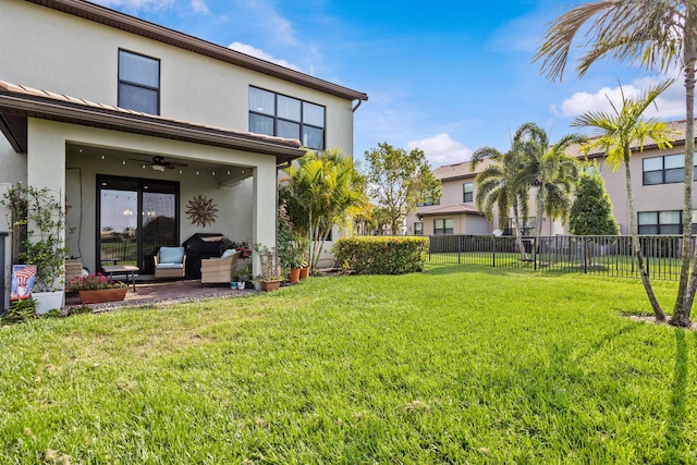 4515 San Fratello Cir, Lake Worth, FL 33467 - view of yard featuring a ceiling fan and a patio area
