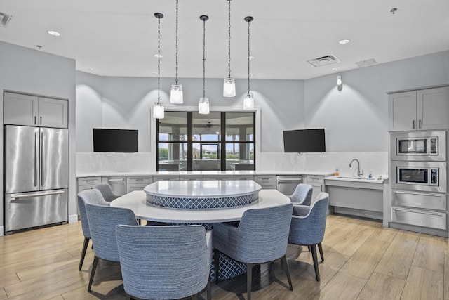 4515 San Fratello Cir, Lake Worth, FL 33467 - dining room featuring light wood finished floors and recessed lighting