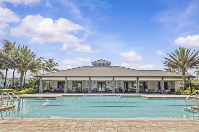 4515 San Fratello Cir, Lake Worth, FL 33467 - community pool with a patio and french doors