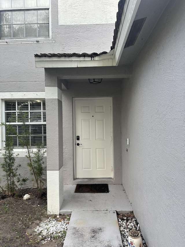 6644 Country Winds Cv, Lake Worth, FL 33463 - view of exterior entry with stucco siding