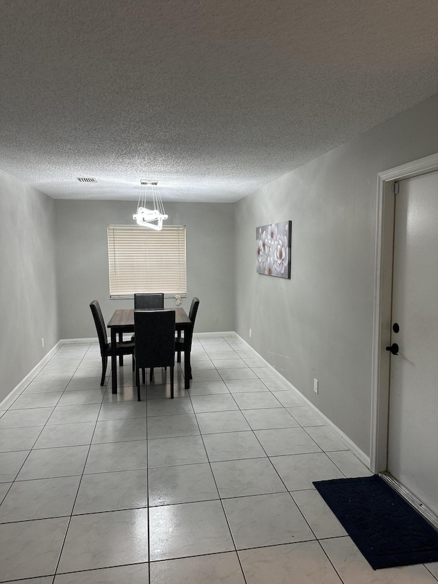 6644 Country Winds Cv, Lake Worth, FL 33463 - dining room with light tile patterned flooring and a textured ceiling