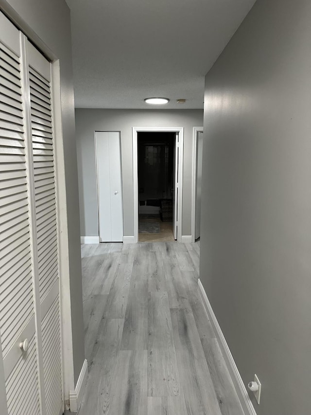 6644 Country Winds Cv, Lake Worth, FL 33463 - hall featuring light wood-style floors and baseboards