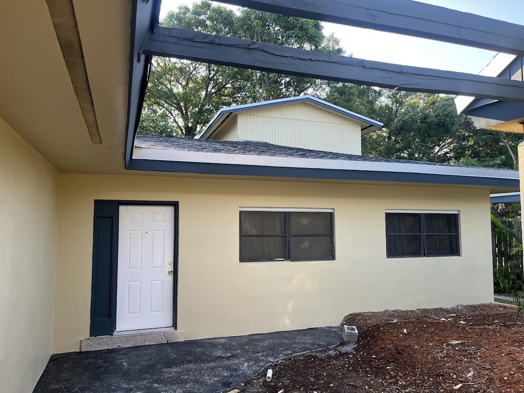 1808 Oleander Blvd, Fort Pierce, FL 34950 - property entrance featuring stucco siding