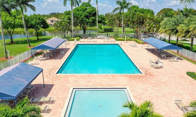 18905 Cloud Lake Cir, Boca Raton, FL 33496 - community pool featuring a water view, a patio area, and view of wooded area
