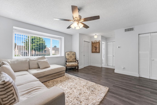 18905 Cloud Lake Cir, Boca Raton, FL 33496 - living area featuring dark wood-style flooring, ceiling fan, a textured ceiling, and baseboards