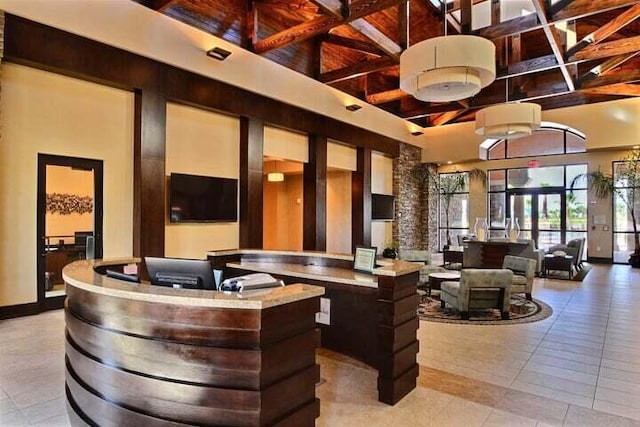 9624 SW Royal Poinciana Dr, Port Saint Lucie, FL 34987 - building lobby with a towering ceiling and beam ceiling