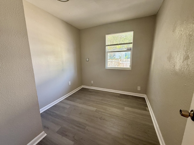 172 W 15th St, Riviera Beach, FL 33404 - unfurnished room with dark wood-style flooring and baseboards