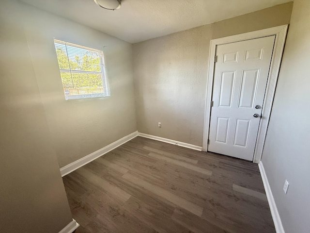 172 W 15th St, Riviera Beach, FL 33404 - spare room featuring wood finished floors and baseboards