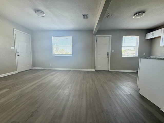 172 W 15th St, Riviera Beach, FL 33404 - foyer featuring wood finished floors, baseboards, a textured ceiling, and beamed ceiling