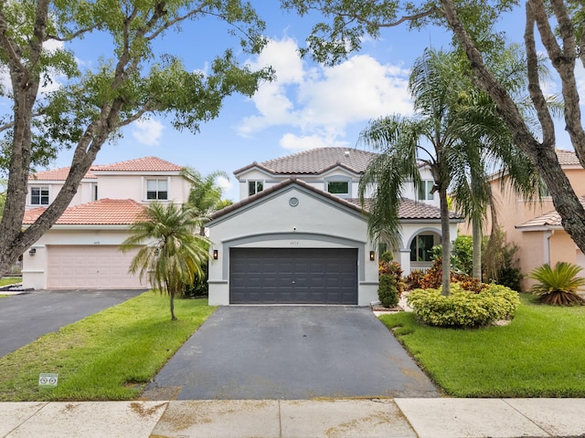 4474 Foxtail Ln, Weston, FL 33331 - mediterranean / spanish-style home with stucco siding, asphalt driveway, a front lawn, and a tile roof