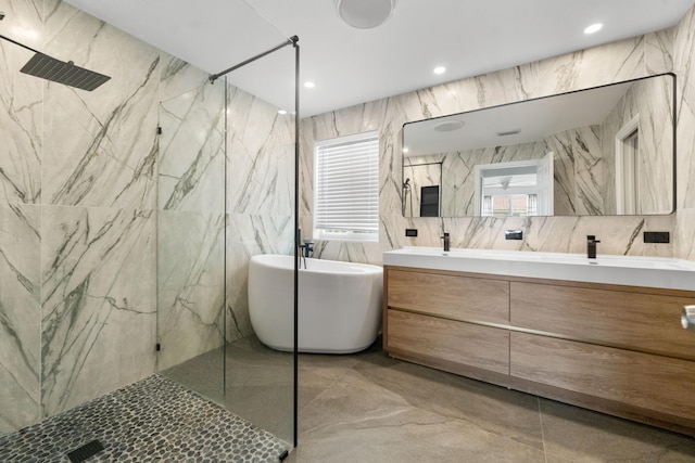 4474 Foxtail Ln, Weston, FL 33331 - full bath featuring tile walls, double vanity, a freestanding tub, and a marble finish shower