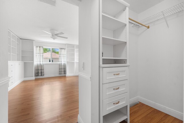 4474 Foxtail Ln, Weston, FL 33331 - walk in closet featuring wood finished floors and ceiling fan