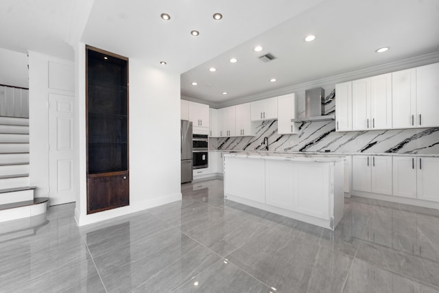 4474 Foxtail Ln, Weston, FL 33331 - kitchen featuring wall chimney exhaust hood, recessed lighting, white cabinetry, appliances with stainless steel finishes, and backsplash