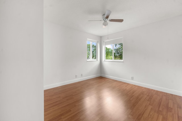 4474 Foxtail Ln, Weston, FL 33331 - unfurnished room with wood finished floors, baseboards, and ceiling fan