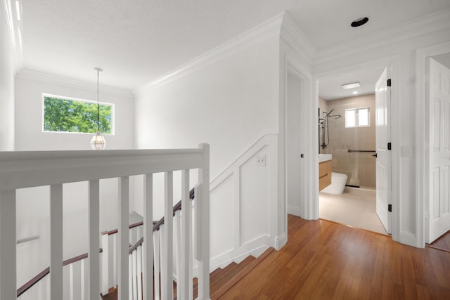 4474 Foxtail Ln, Weston, FL 33331 - hallway featuring an upstairs landing, light wood-type flooring, and ornamental molding