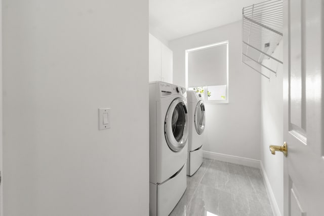 4474 Foxtail Ln, Weston, FL 33331 - laundry room featuring independent washer and dryer, baseboards, and cabinet space