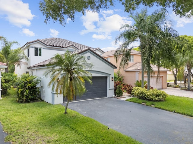 4474 Foxtail Ln, Weston, FL 33331 - mediterranean / spanish home featuring driveway, a tile roof, and a front yard