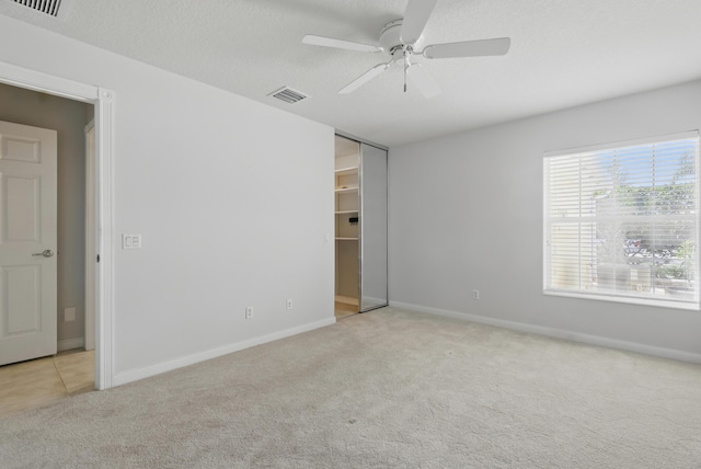 10453 SW Stratton Dr, Port Saint Lucie, FL 34987 - unfurnished bedroom with carpet flooring, baseboards, ceiling fan, and a closet