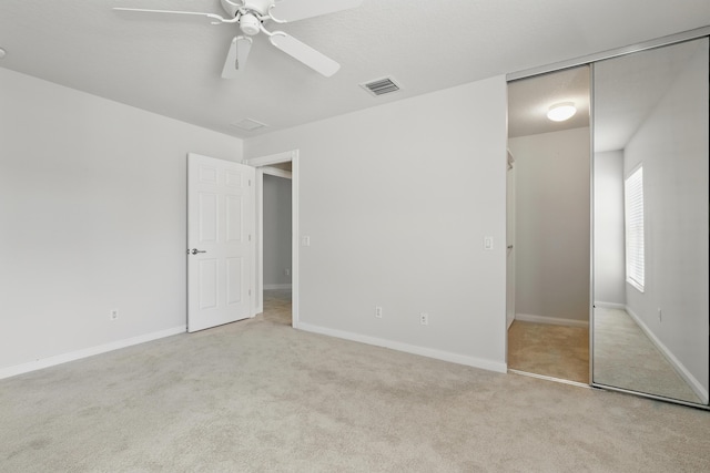 10453 SW Stratton Dr, Port Saint Lucie, FL 34987 - unfurnished bedroom featuring carpet flooring, a closet, baseboards, and a ceiling fan