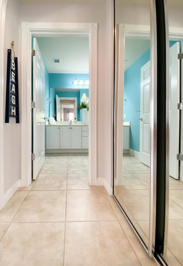 10453 SW Stratton Dr, Port Saint Lucie, FL 34987 - hallway with baseboards and light tile patterned flooring