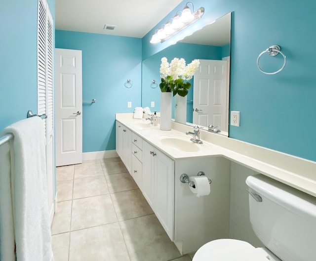 10453 SW Stratton Dr, Port Saint Lucie, FL 34987 - bathroom with tile patterned flooring, double vanity, and toilet