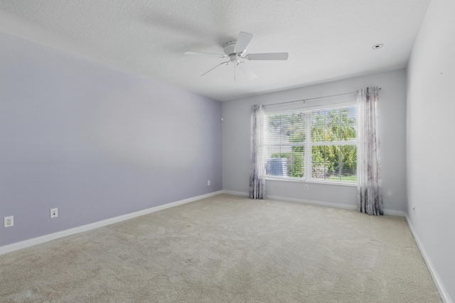 10453 SW Stratton Dr, Port Saint Lucie, FL 34987 - spare room with ceiling fan, carpet flooring, baseboards, and a textured ceiling