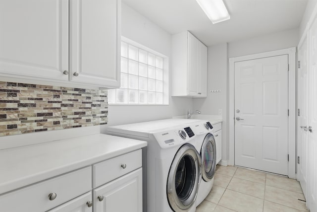 10453 SW Stratton Dr, Port Saint Lucie, FL 34987 - laundry room with independent washer and dryer, cabinet space, and light tile patterned floors