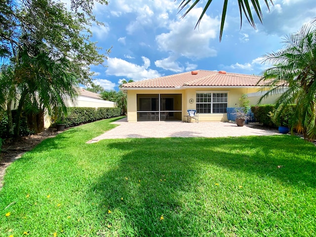 10453 SW Stratton Dr, Port Saint Lucie, FL 34987 - back of property featuring stucco siding, a patio area, a yard, and a tile roof