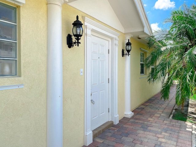 10453 SW Stratton Dr, Port Saint Lucie, FL 34987 - doorway to property with stucco siding