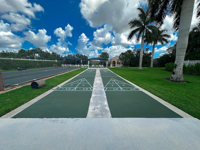 10453 SW Stratton Dr, Port Saint Lucie, FL 34987 - view of property's community with a yard, shuffleboard, and a gazebo