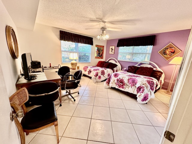 3301 Aruba Way Unit A1, Coconut Creek, FL 33066 - bedroom featuring multiple windows, a desk, light tile patterned floors, a textured ceiling, and ceiling fan