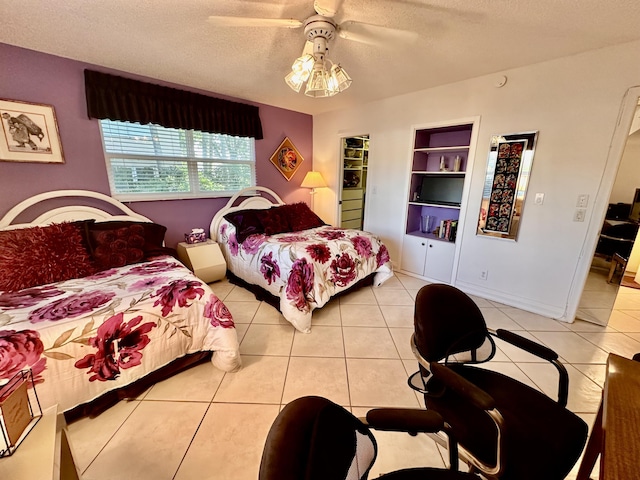 3301 Aruba Way Unit A1, Coconut Creek, FL 33066 - bedroom featuring a textured ceiling, light tile patterned floors, and a ceiling fan