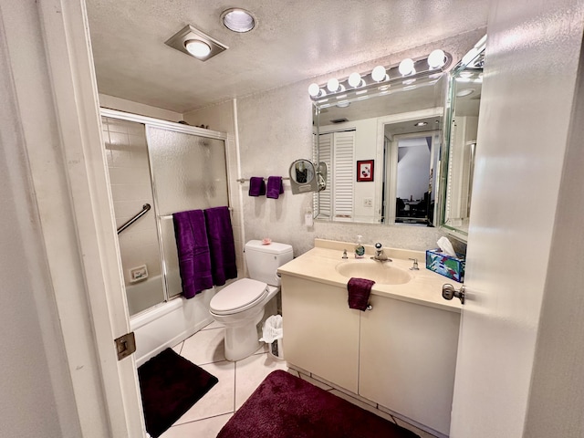 3301 Aruba Way Unit A1, Coconut Creek, FL 33066 - full bath featuring vanity, tile patterned flooring, toilet, enclosed tub / shower combo, and a textured ceiling