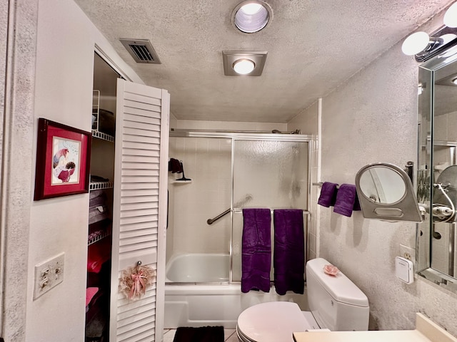 3301 Aruba Way Unit A1, Coconut Creek, FL 33066 - full bathroom with toilet, a textured ceiling, enclosed tub / shower combo, and a textured wall