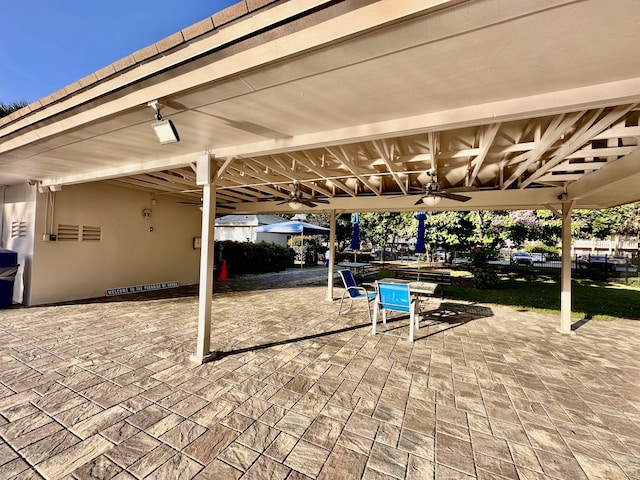 3301 Aruba Way Unit A1, Coconut Creek, FL 33066 - view of patio with ceiling fan and outdoor dining space