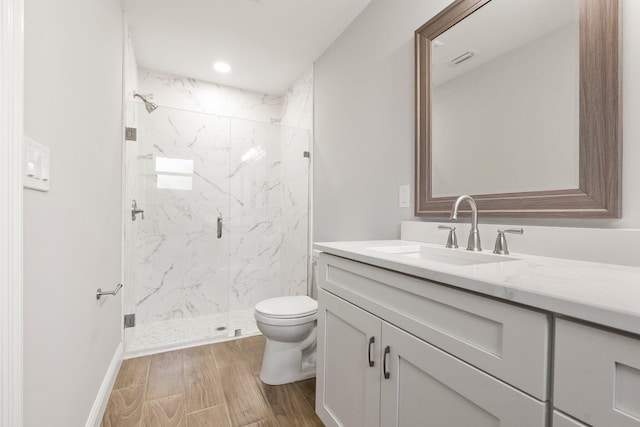 5609 Sunset Blvd, Fort Pierce, FL 34982 - full bath with a marble finish shower, vanity, toilet, wood finished floors, and baseboards