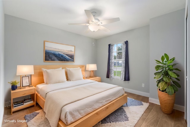 5609 Sunset Blvd, Fort Pierce, FL 34982 - bedroom featuring baseboards, ceiling fan, and wood finished floors