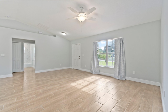 5609 Sunset Blvd, Fort Pierce, FL 34982 - empty room with light wood-style floors, ceiling fan, baseboards, and vaulted ceiling